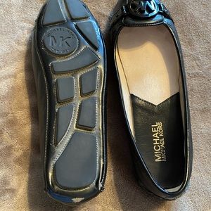 Michael Kors black leather flats.